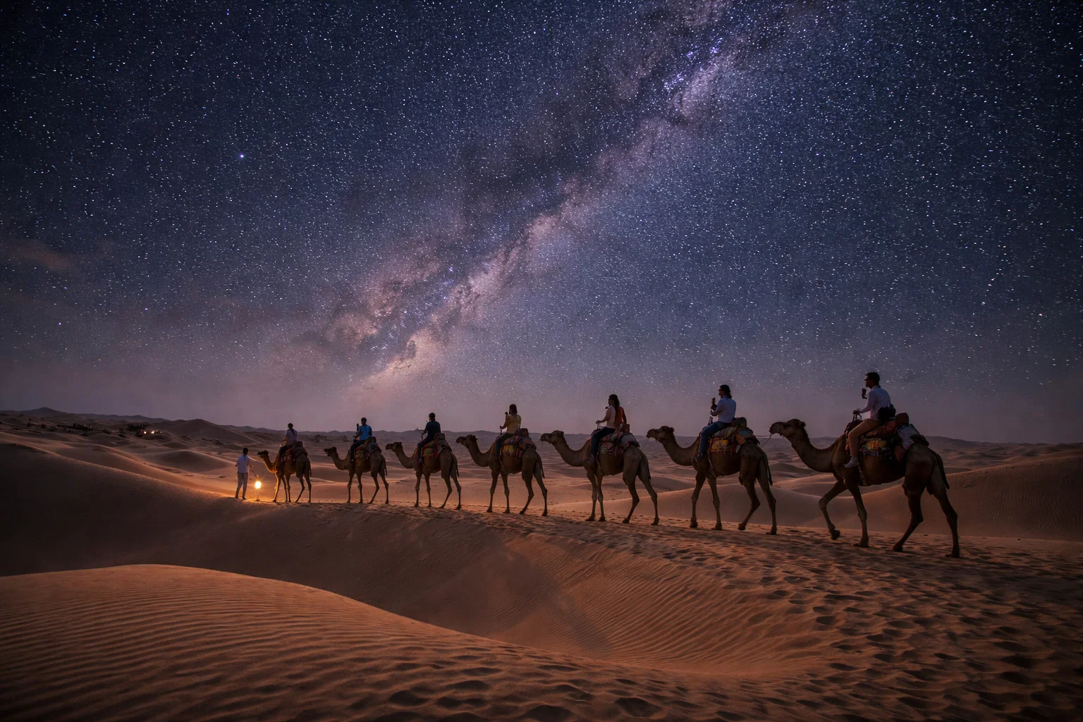 Camel safari on the Sam sand dunes at sunset