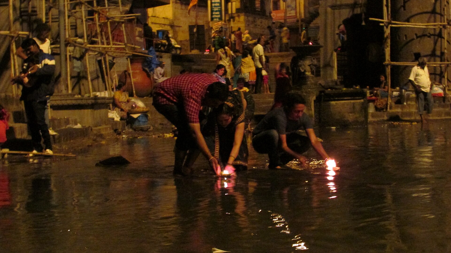 Lamps lit on the Godavari at evening aarti