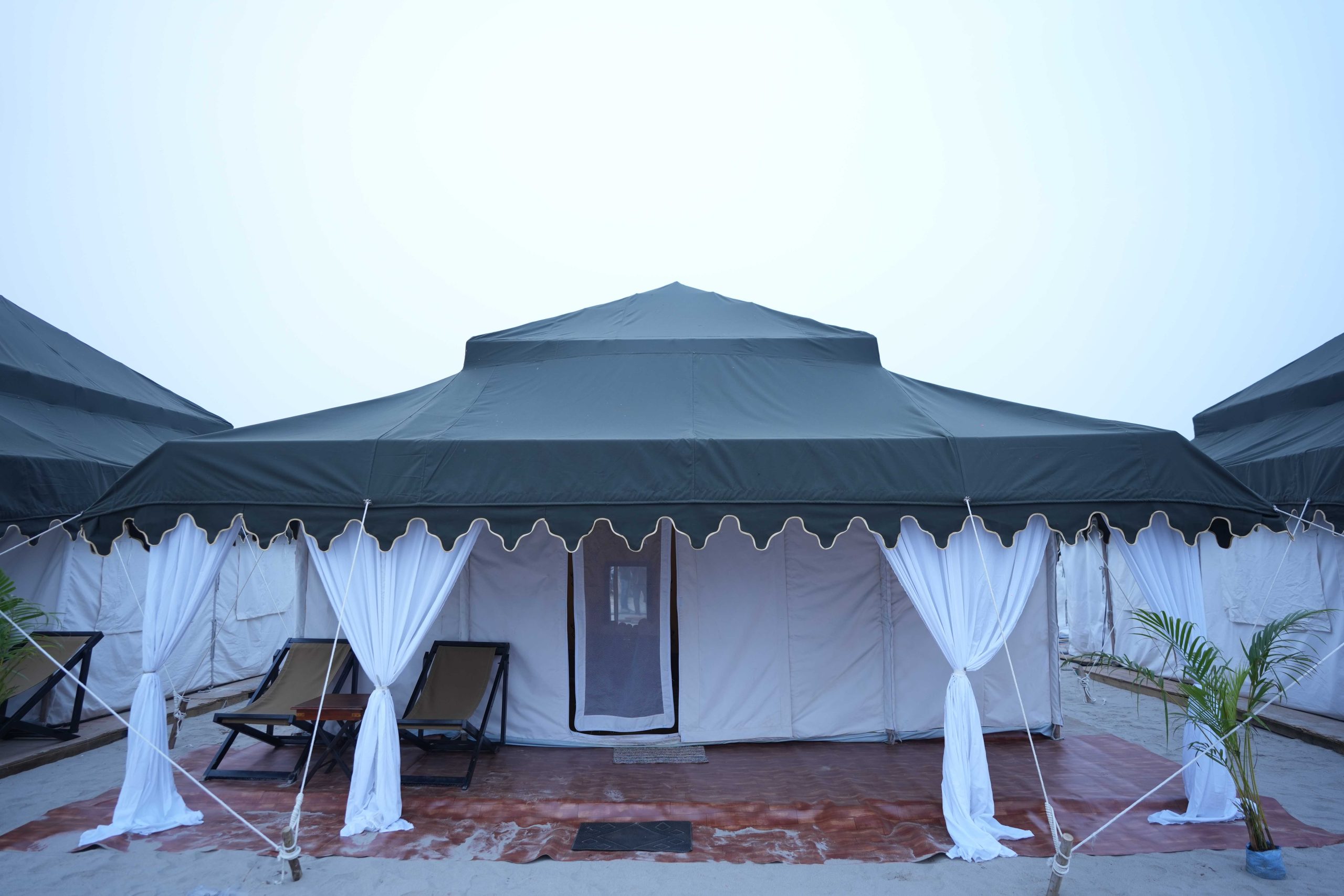 Swiss tent bedroom with premium linen and wooden furniture